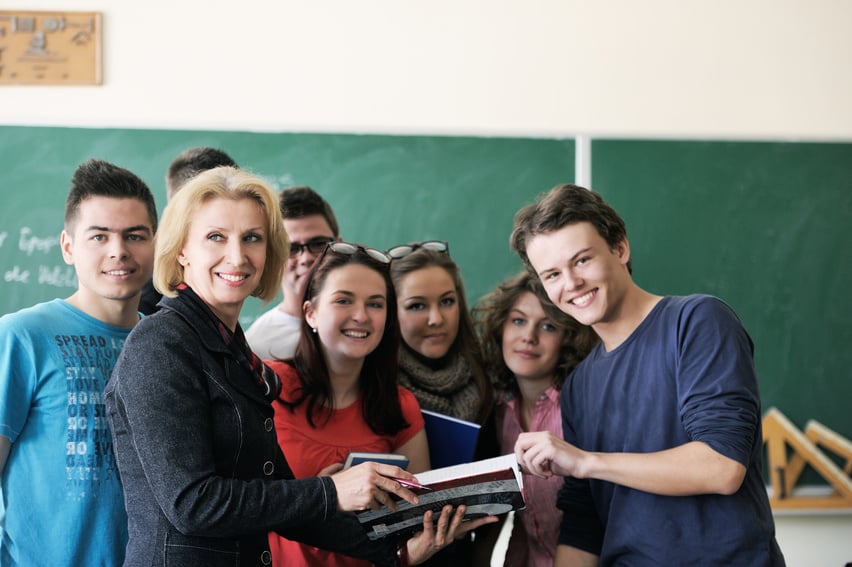 Teacher Holding a Copybook